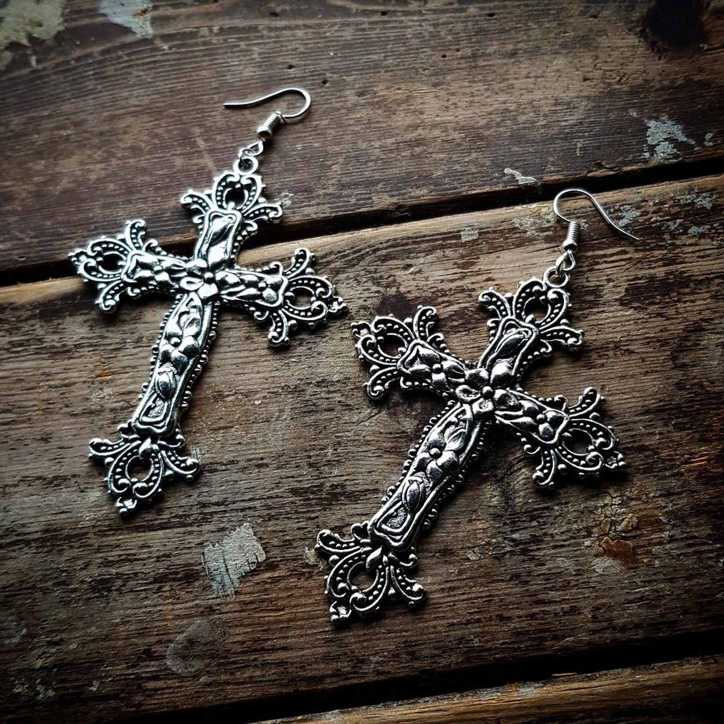 Inverted Crucifix earrings with black glass crystal teardrops. Classic gothic dangling ornamental satanic earrings